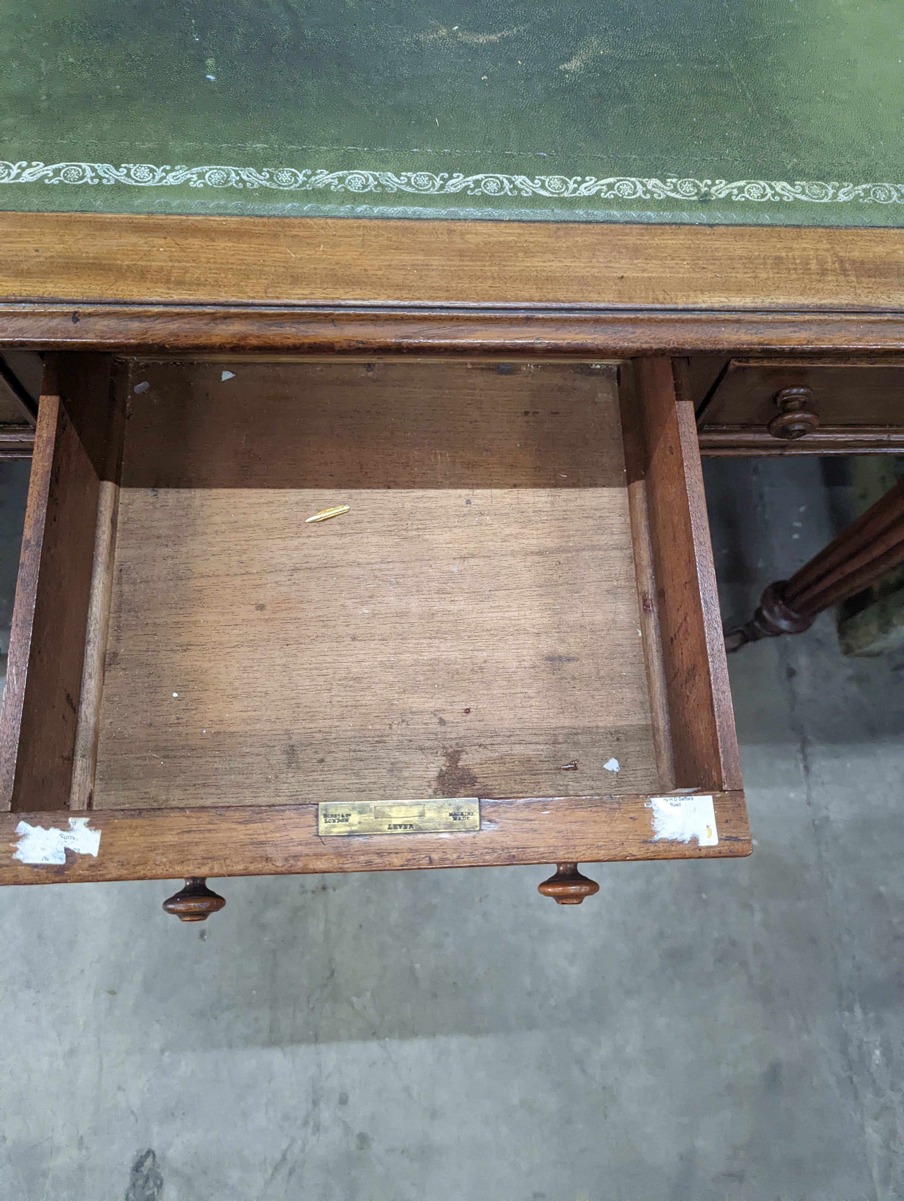 A Victorian mahogany three drawer writing table on fluted legs, width 106cm, depth 66cm, height 75cm